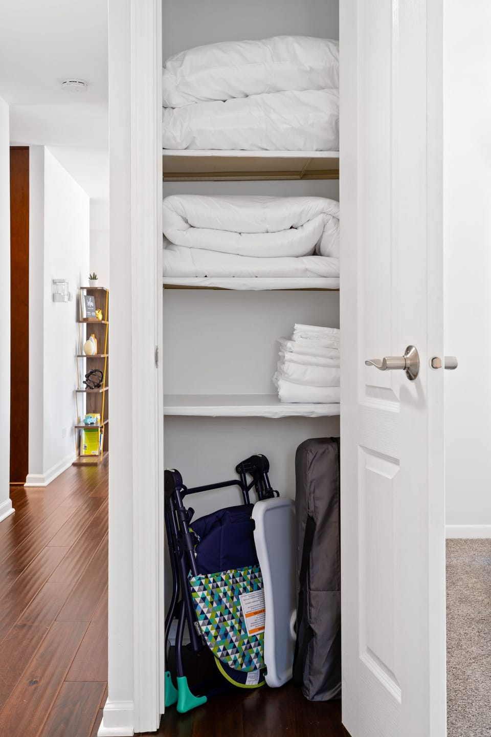 linens are provided for the living room futon, a high chair and a pack and play