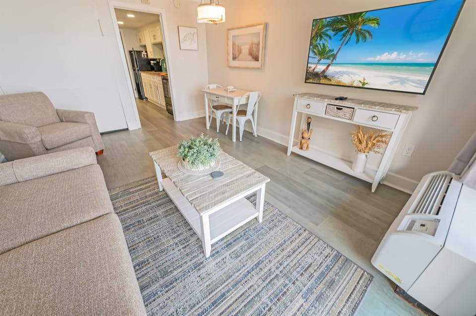 - Kick back, relax, and feel the coastal vibes in this stylish, open concept space - Stream your favorite shows, gather for meals, or just enjoy the inviting atmosphere - The perfect spot to recharge after a sun oaked day at the beach