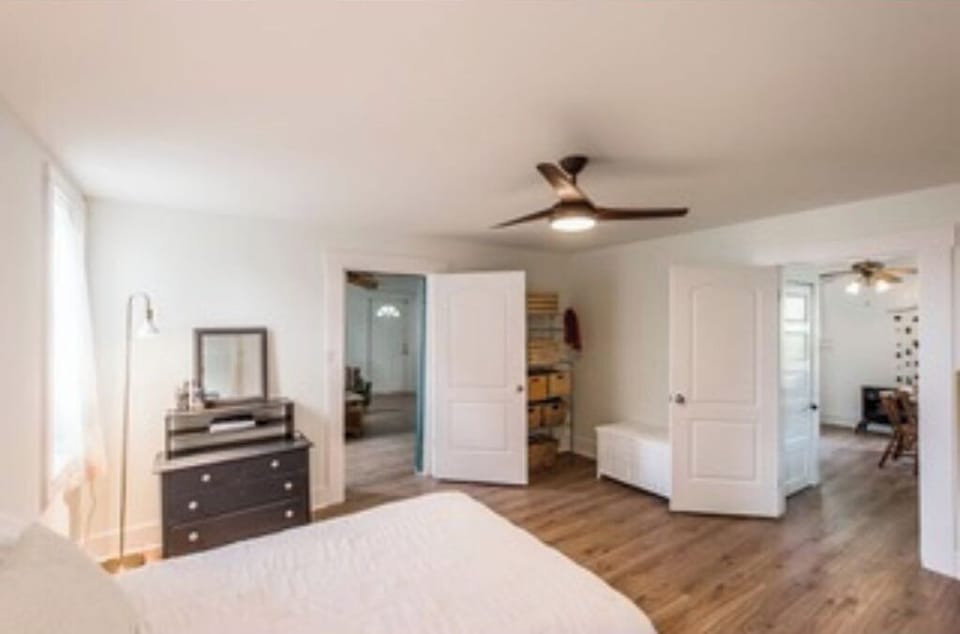 The master bedroom with view into dining room.
