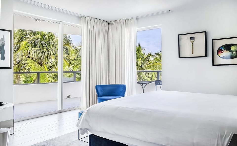 Wake up to sunlit comfort steps from your private balcony.