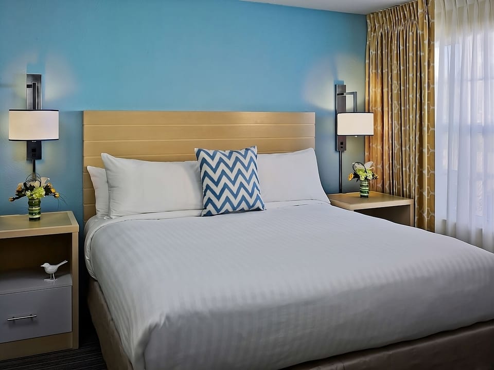 Wake up gently with soft curtains and a serene sleeping space.