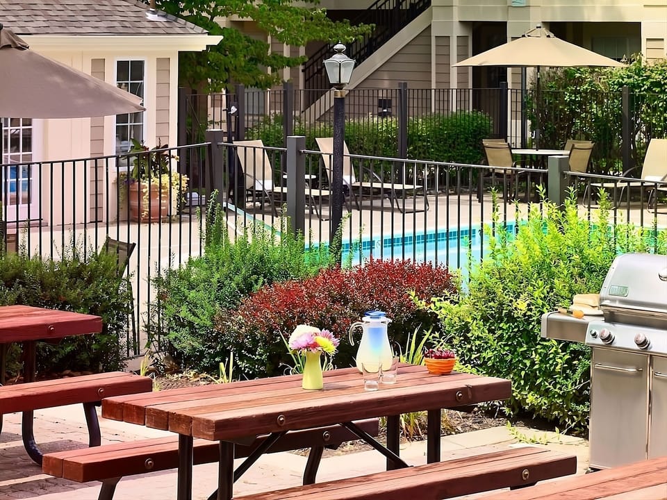 Savor sunny afternoons grilling and relaxing by the poolside.