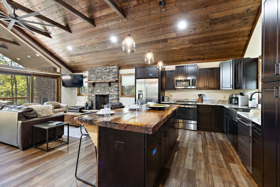 Raw Edge Wood Top Island and Stainless Appliances in the Kitchen