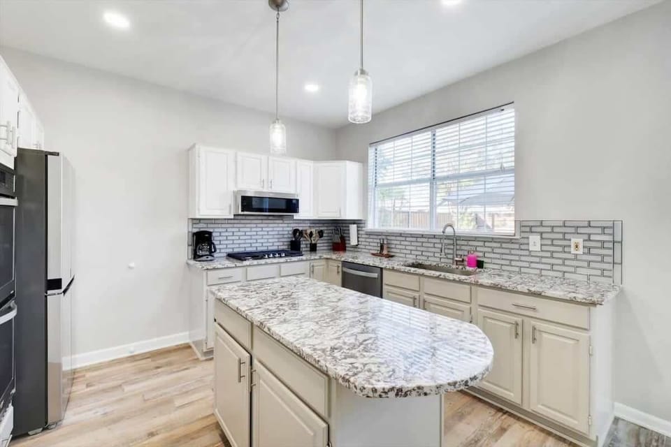 Fully equipped for all your cooking needs, this charming top-of-the-line kitchen is missing only one thing – you!