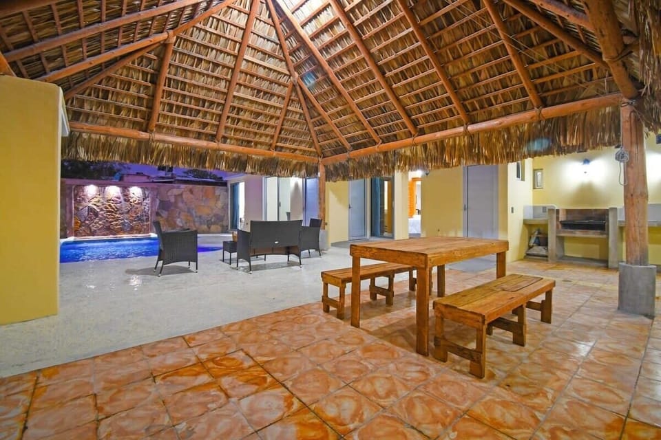 Enjoy a cookout day or meal poolside under the palapa