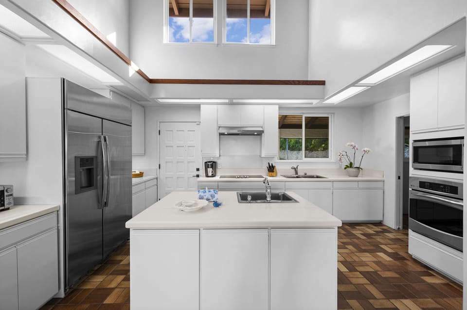 Spacious, fully-equipped kitchen with stainless steel appliances.