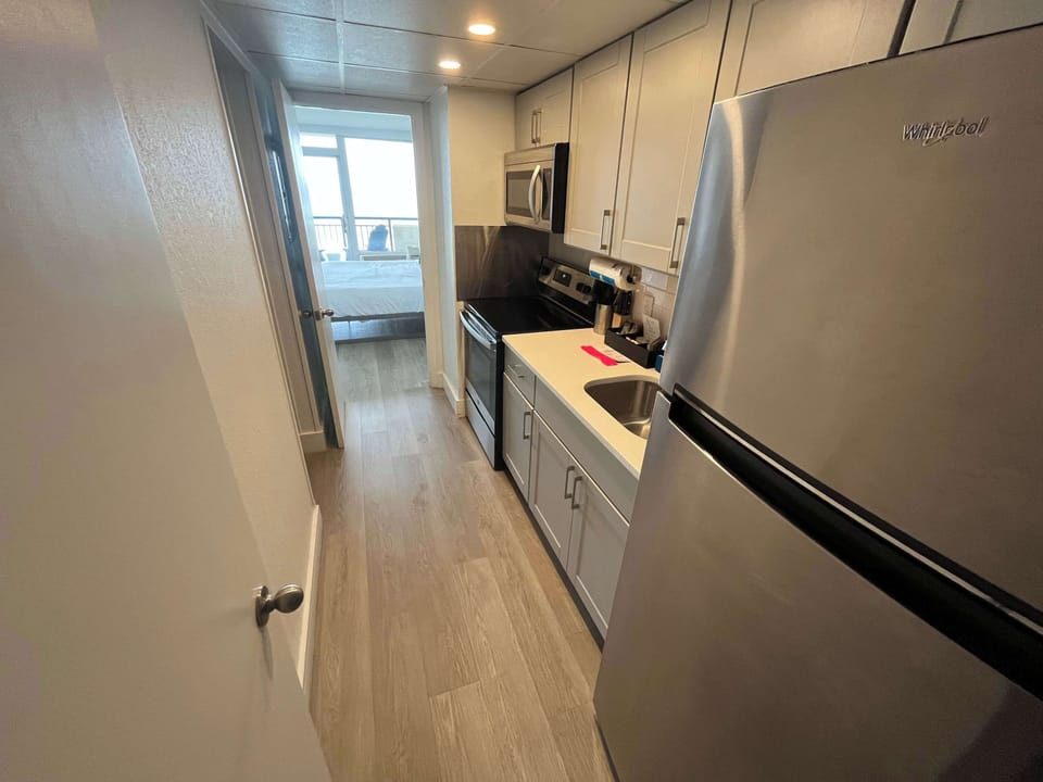 Cook with ease in this stylish, full-featured kitchen featuring stainless steel appliances, modern finishes, and everything you need for a comfortable home-away-from-home experience.
