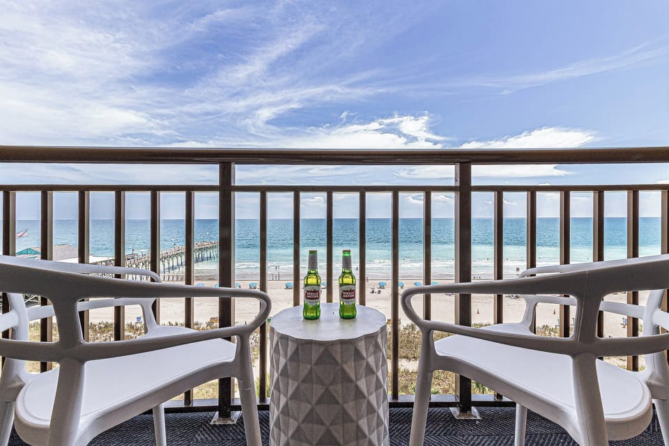 Enjoy stunning ocean views from your private balcony, complete with cozy seating to relax and take in the sights of the beach. Perfect for morning coffee or sunset evenings!