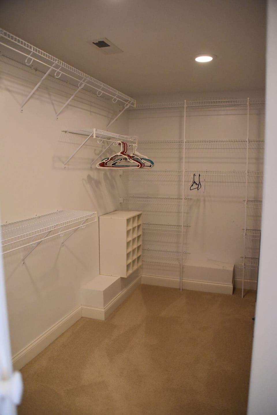 Walk in closet primary bedroom