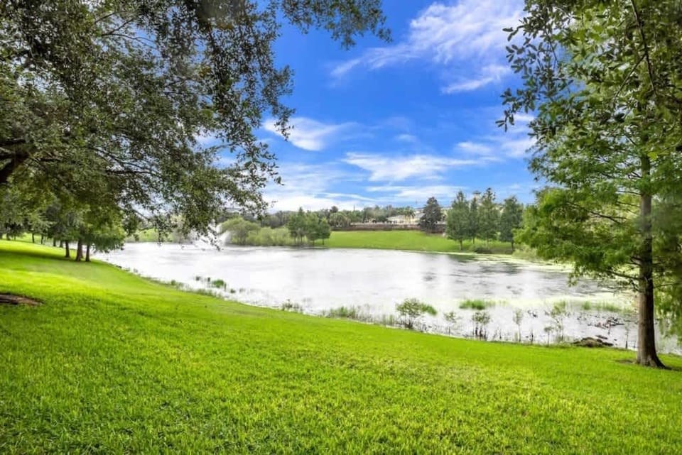 - Scenic lake view with green lawns peaceful nature and relaxing outdoor vibes
- Waterfront scenery perfect for morning walks photos and quiet moments
- Natural surroundings add calm charm to your vacation rental experience  