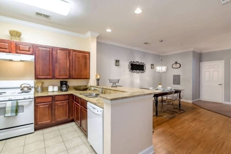 - Open kitchen with roomy counters and warm wood cabinets great for cooking
- Easy flow into dining and living areas keeps everyone connected
- Bright welcoming layout ideal for relaxed vacation meals
