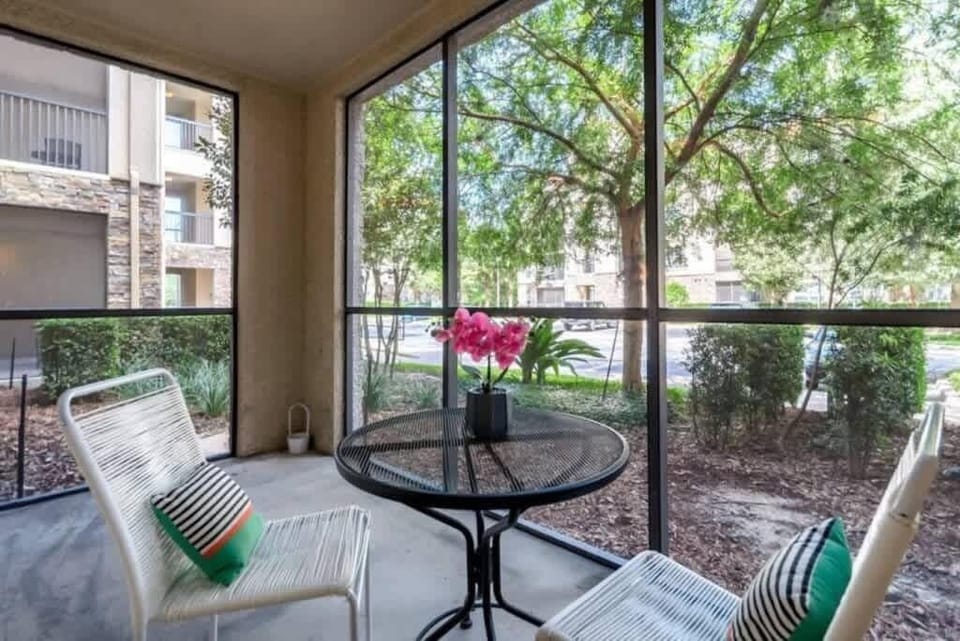 - Screened patio seating surrounded by greenery and fresh air
- Enjoy quiet morning coffee in this peaceful outdoor nook
- Perfect spot for unwinding and taking in tranquil views
