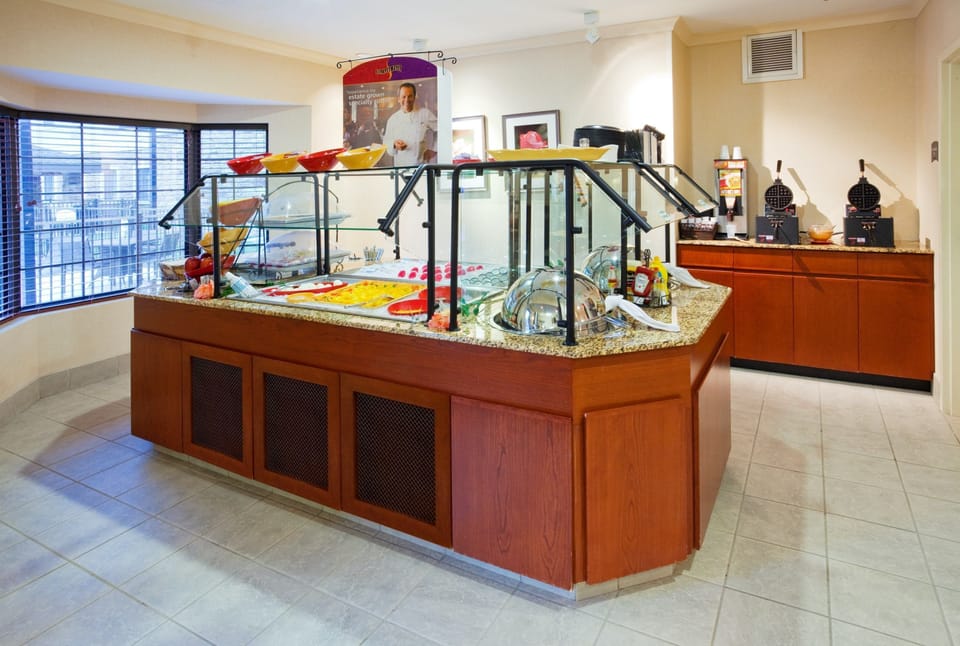 Indulge in a delicious start to your day with a variety of breakfast options at our inviting buffet.