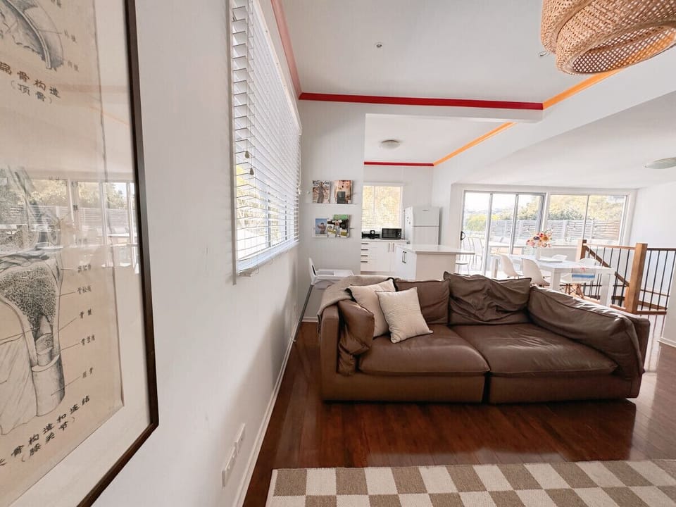Lounge Room - Ultimate Entertainment Hub with Quirky Touches  Our lounge room is the perfect spot for entertainment and relaxation. Featuring a massive 90-inch TV with easy access to streaming services, you’ll have everything you need for a cozy movie nig