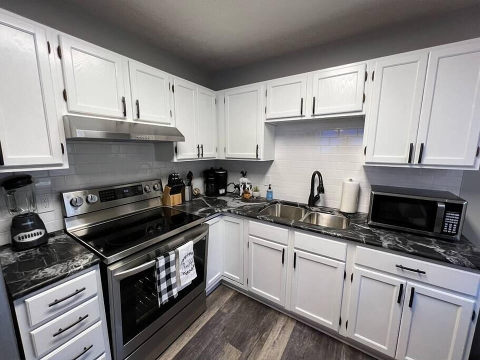 Beautifully remodeled kitchen with granite counters and high quality stainless steel appliances.