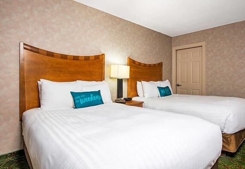 Stretch out comfortably with two cozy beds and warm lighting.