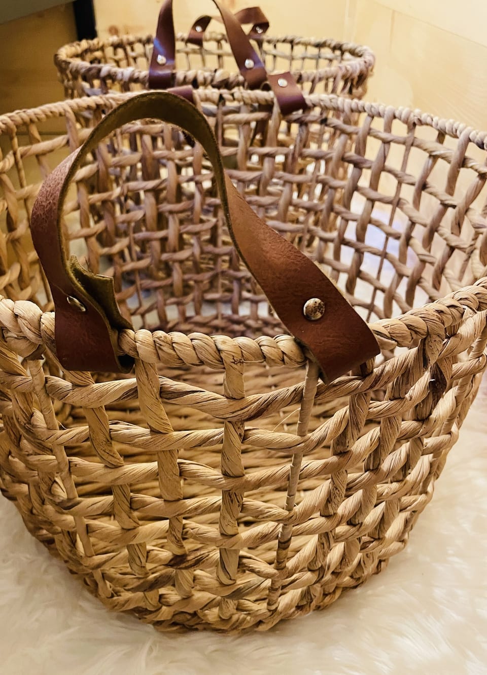 Baskets under bed for storage.