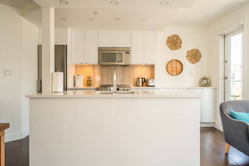 Open concept kitchen with plenty of countertop space to serve, eat or mingle. 