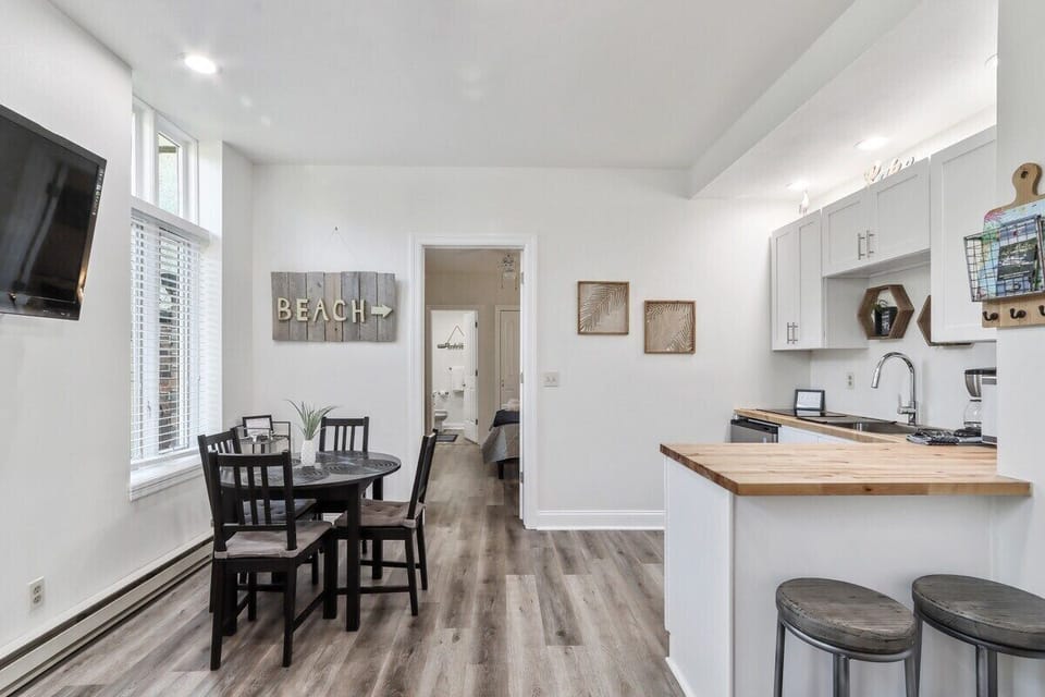 Open concept of dining area, living room & kitchen