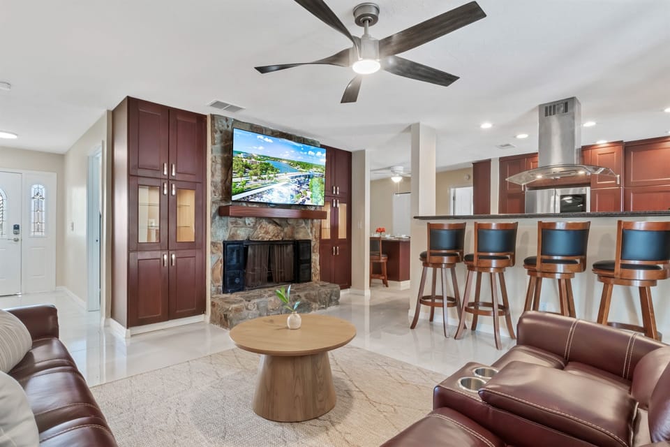 Savor your morning coffee or a family breakfast around the sleek marble island, perfectly designed for both comfort and conversation.