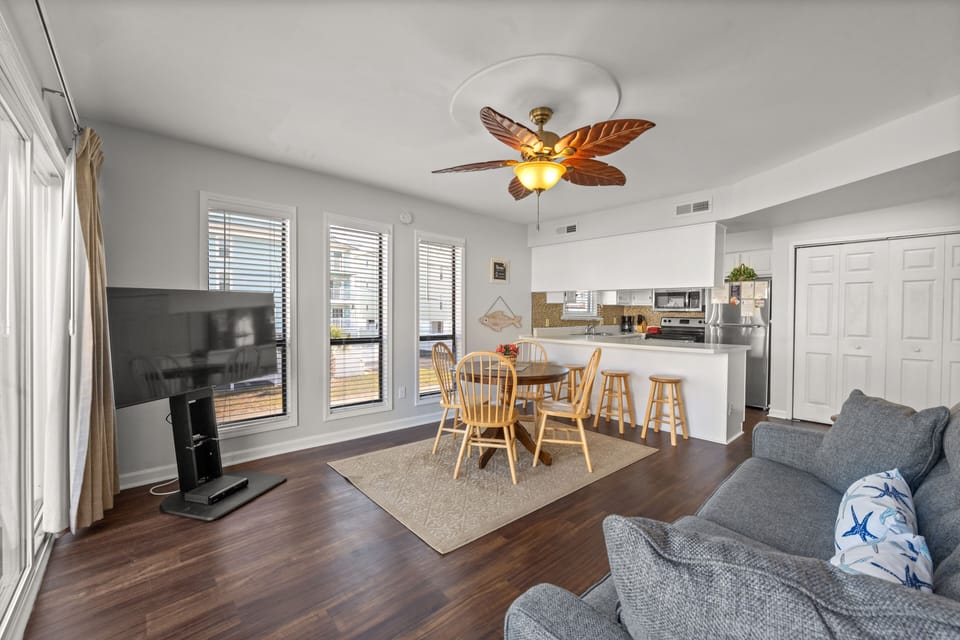 This bright and sunny room allows everyone to enjoy a meal together.