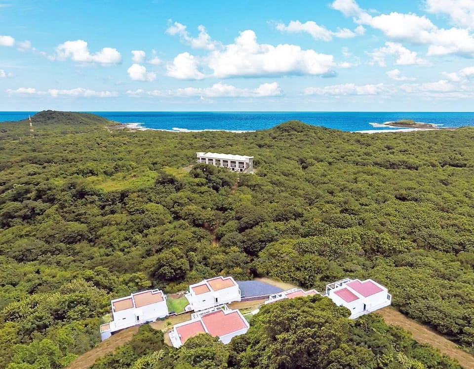 Aerial view.  House #3 is bottom right row beside the parking lot.
