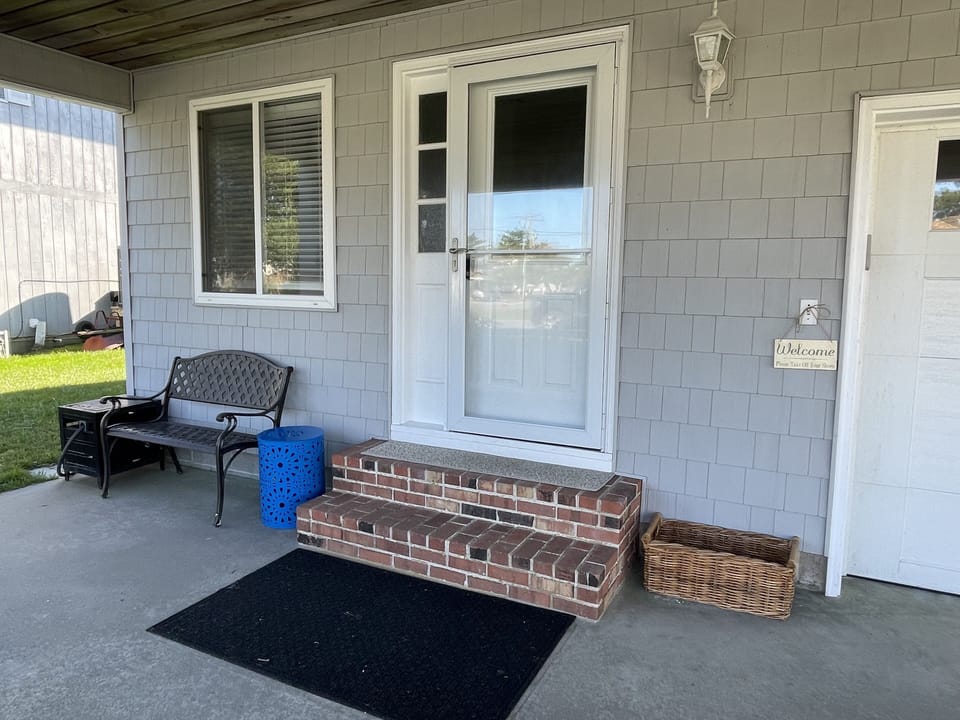 Front door, opens to one of two living rooms.