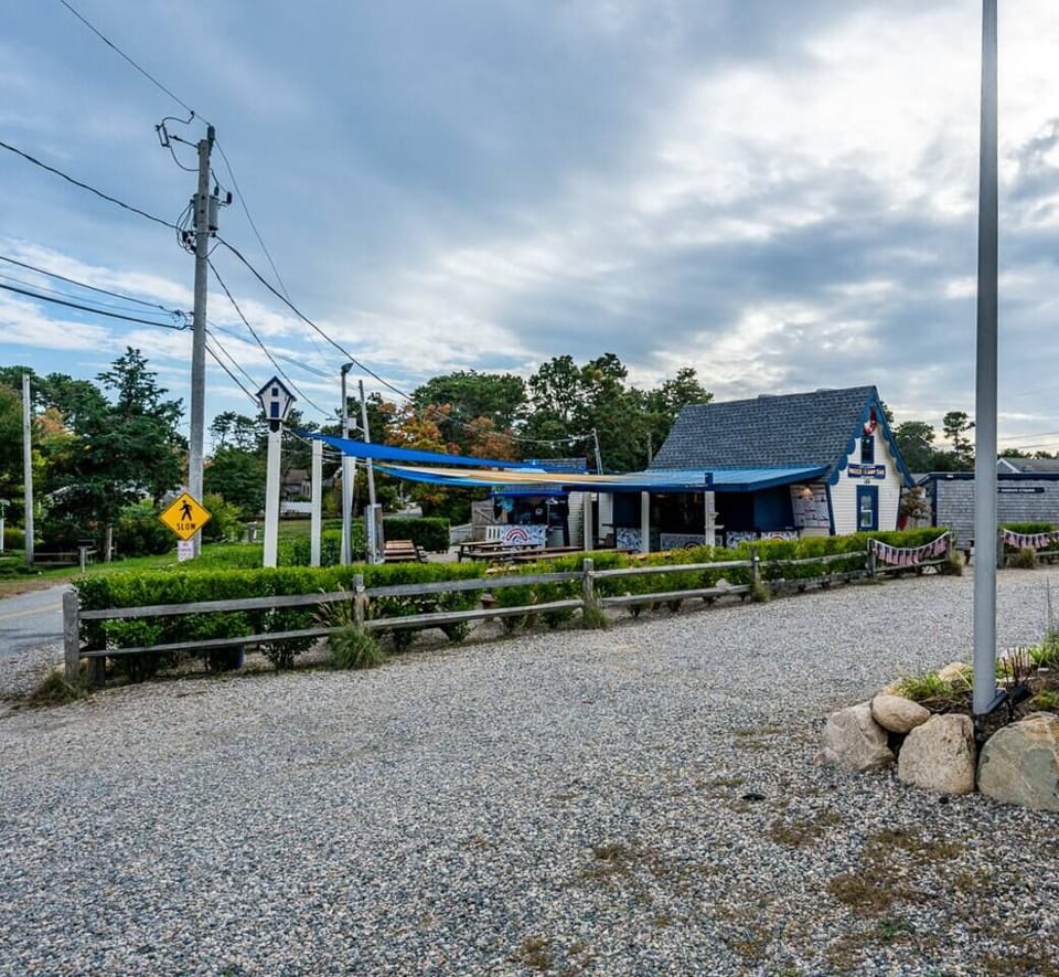 Visit the well-known Dog House—an 8-10 minute walk down Lower County Rd. Explore their menu and you'll understand their popularity!