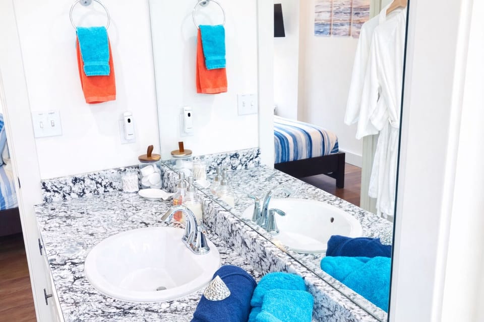Primary ensuite bathroom w/shower off the king bedroom on main level. 