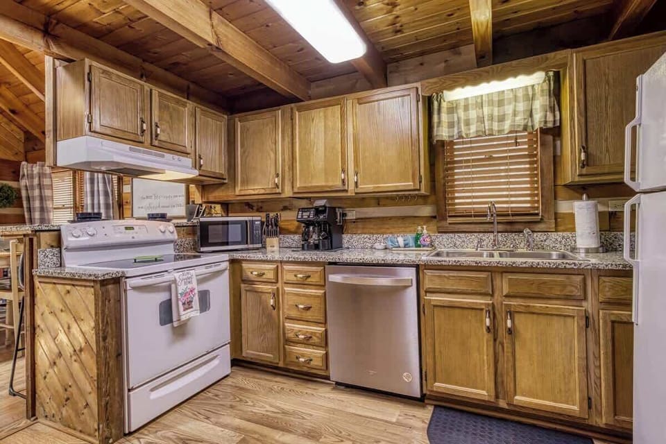 Kitchen: Whip up family meals in this charming, fully equipped kitchen with rustic wooden beams!