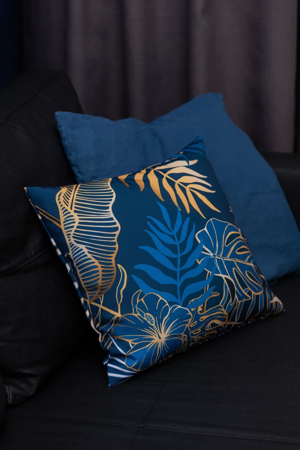 A detailed close-up of a decorative pillow with intricate patterns, enhancing the room’s elegance.
