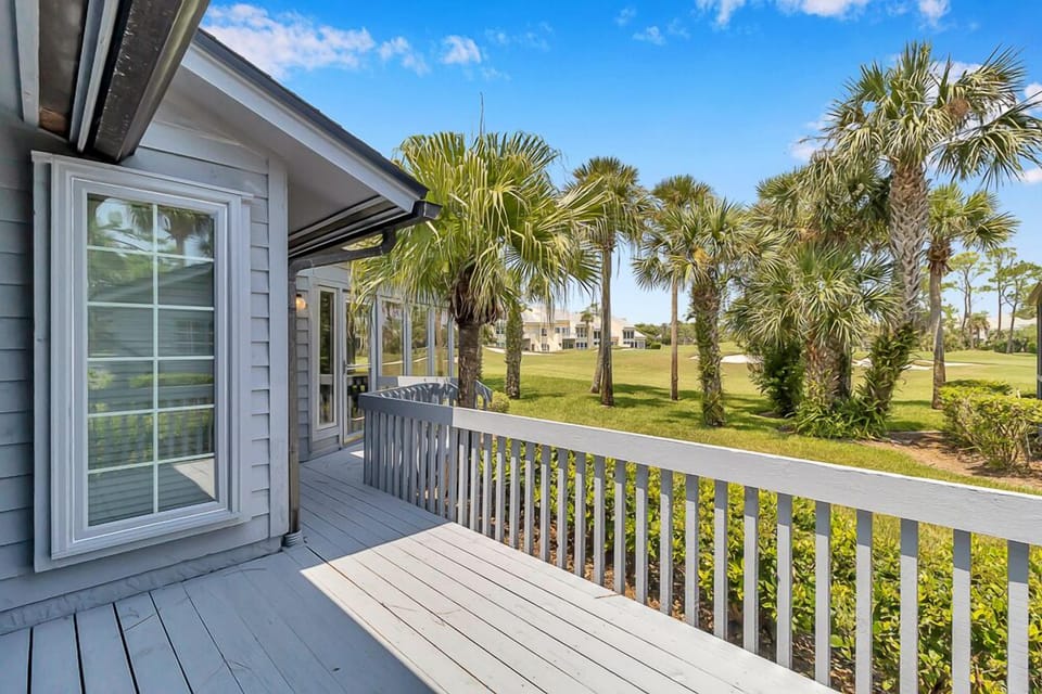 Deck overlooking Sawgrass Country Club - - Scenic private deck with wood railings and relaxing views of palm lined fairways
- Step outside and enjoy quiet morning coffee overlooking beautiful green landscapes
- Direct access from the home makes this spot ideal for sunshine breaks