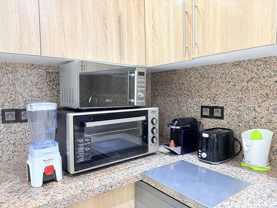 A fully equipped kitchen, complete with a Nespresso machine.