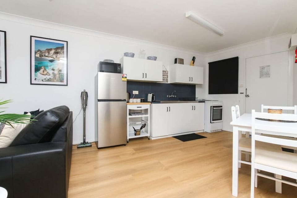 Living area, kitchen and dining table
