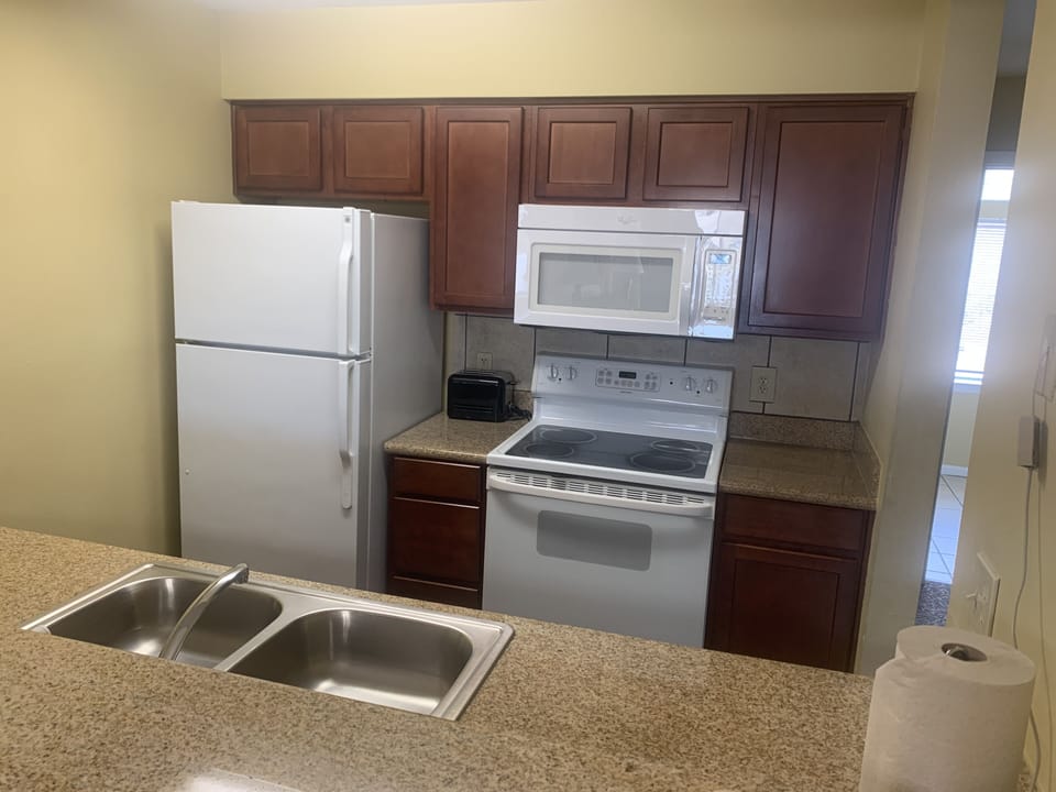 Fully equipped kitchen for you to dine in or store your takeout for later!