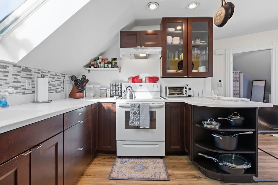 Kitchen with Oven, Dishwasher, and Cooking Supplies 