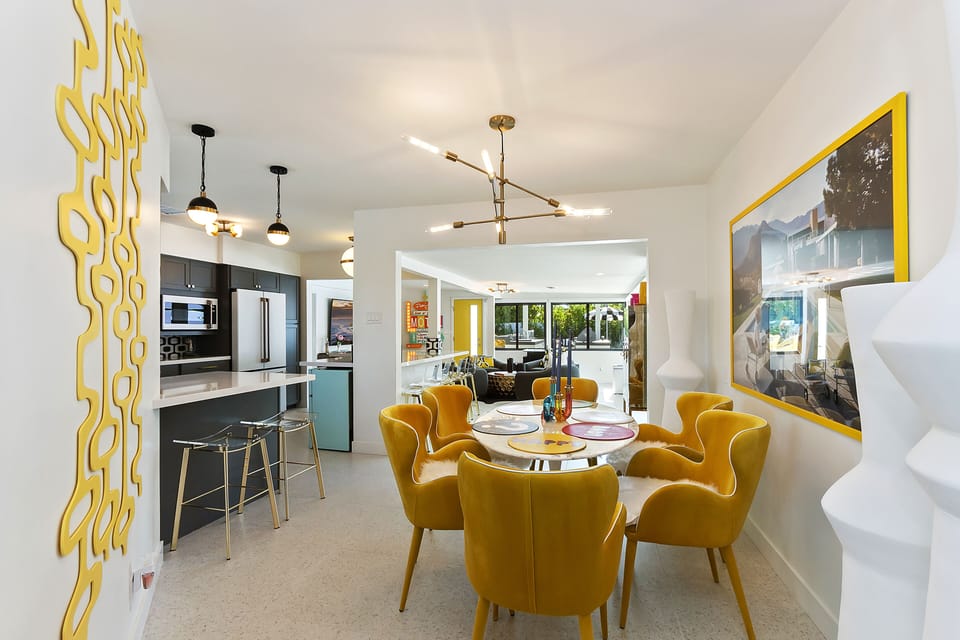 Dining area (6 chairs),  kitchen counter (8 stools) & party room seats 6 more!