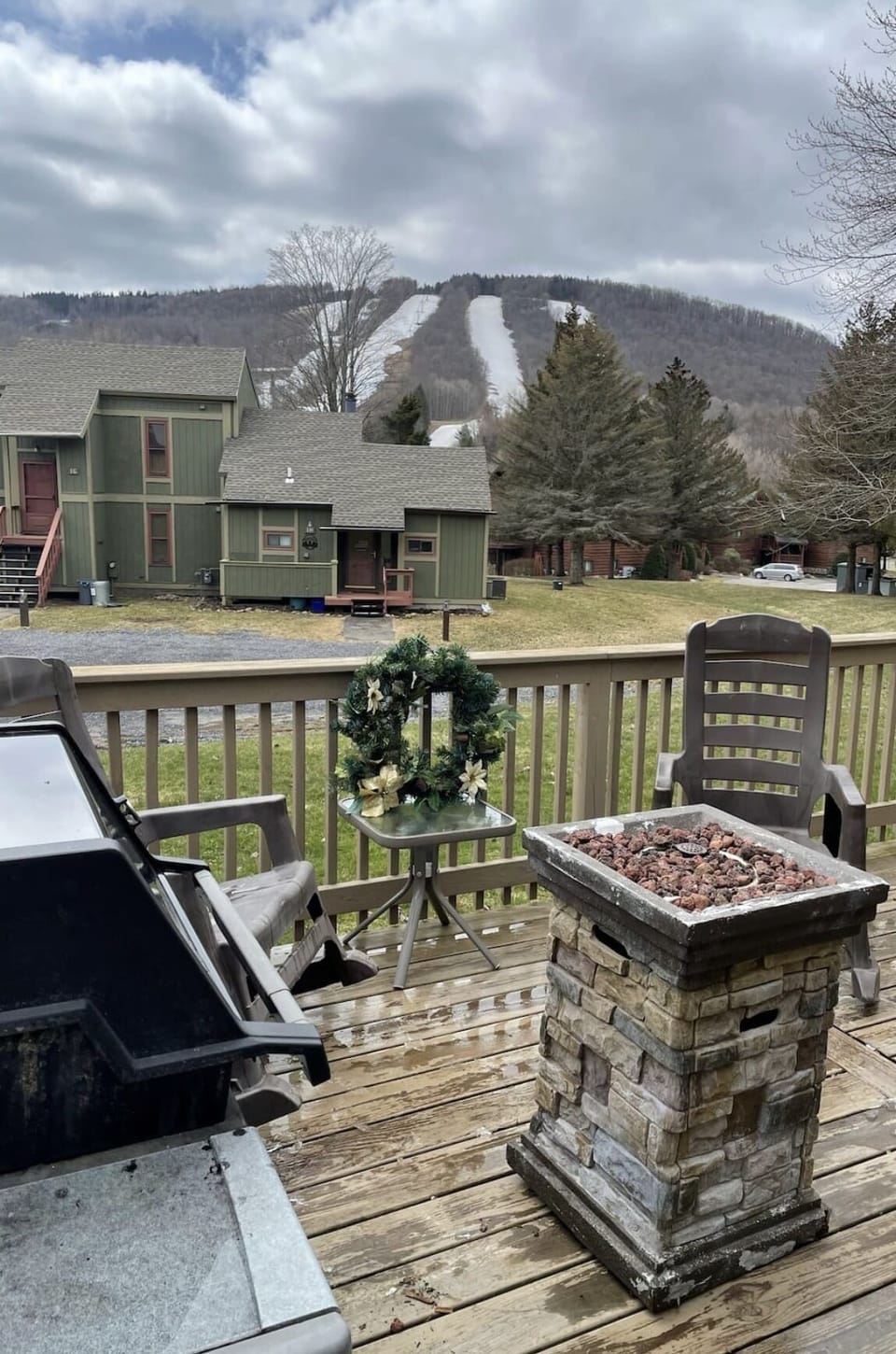 Outdoor patio has a grill, updated fire pit and plenty of chairs.