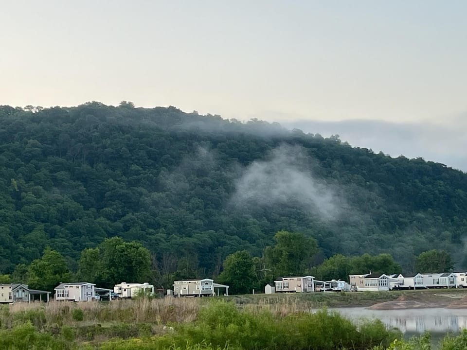 view from the back deck of Wisconsin bluffs and low hanging clouds