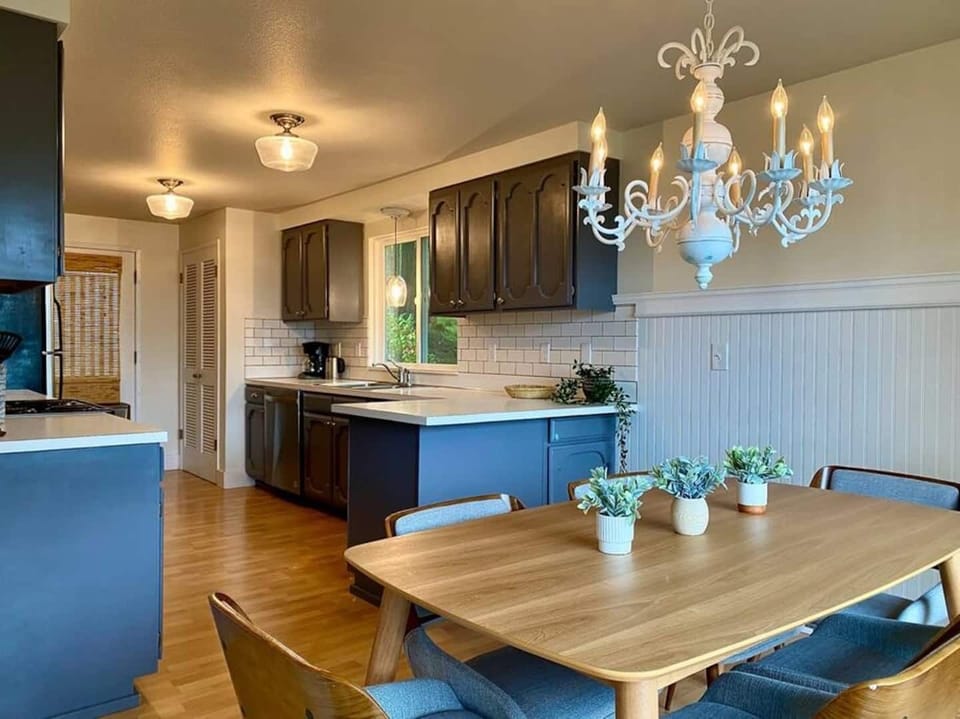 The kitchen and dining room open up to the deck outside adding tons of light to the room.