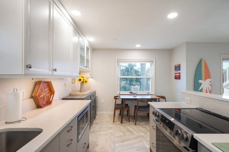 Updated kitchen with quartz counters and stainless appliances