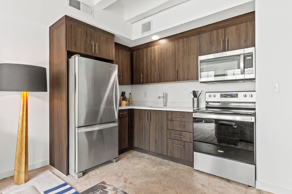 Kitchenette has a full size fridge, Stove, and microwave. No dishwasher. (1)