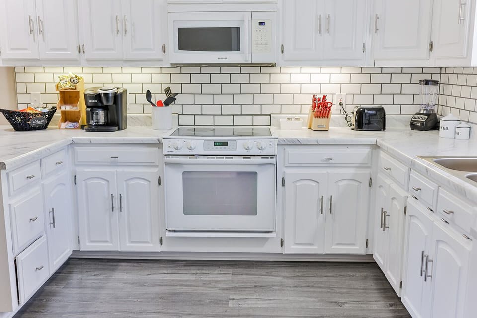 Very nice kitchen with stove, microwave, Keurig coffee pot w/all the condiments