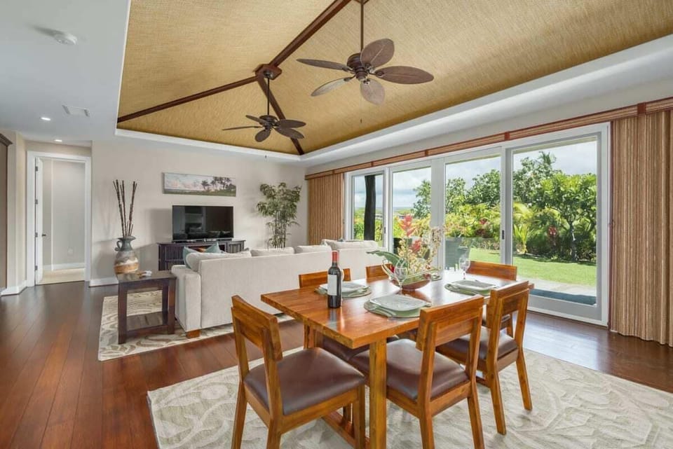 Dining, kitchen and living areas all have garden views.