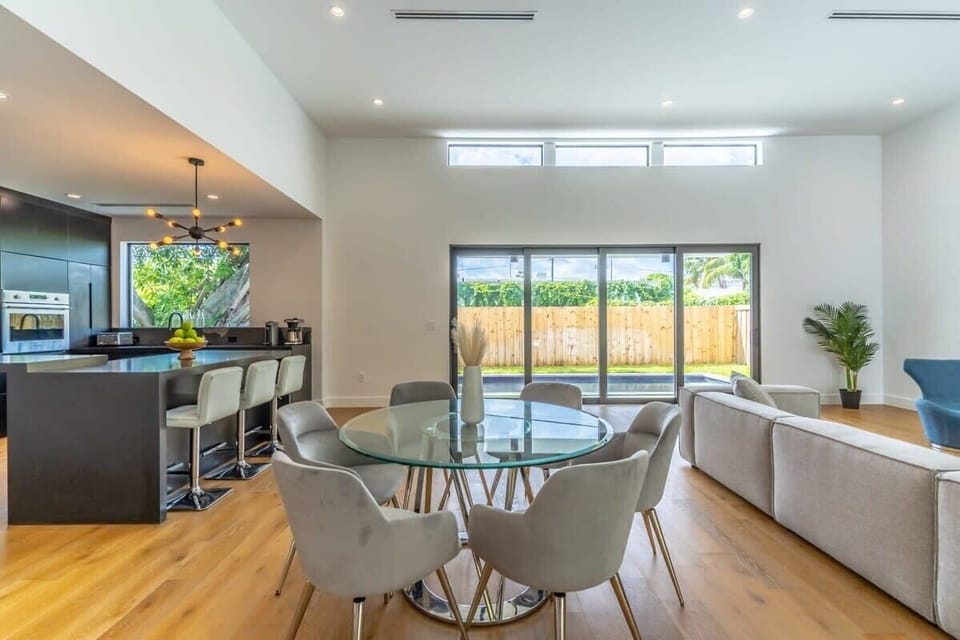 6 person dining table in close proximity to kitchen