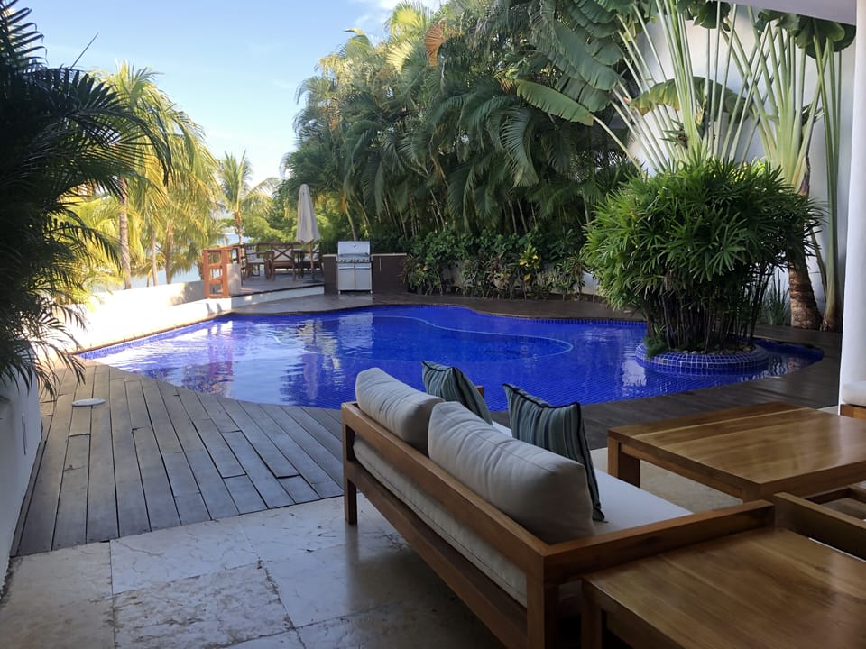 View of the pool and the grill.  A wonderful place to have coffee in the morning