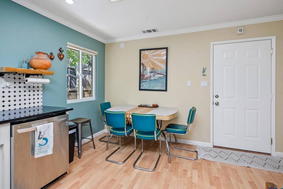 Retro-style kitchen with everything you need to prepare and set an amazing meal, with seating for six at the dining room table. Dishwasher, gas range, coffee maker, crock pot and other small appliances are provided. 