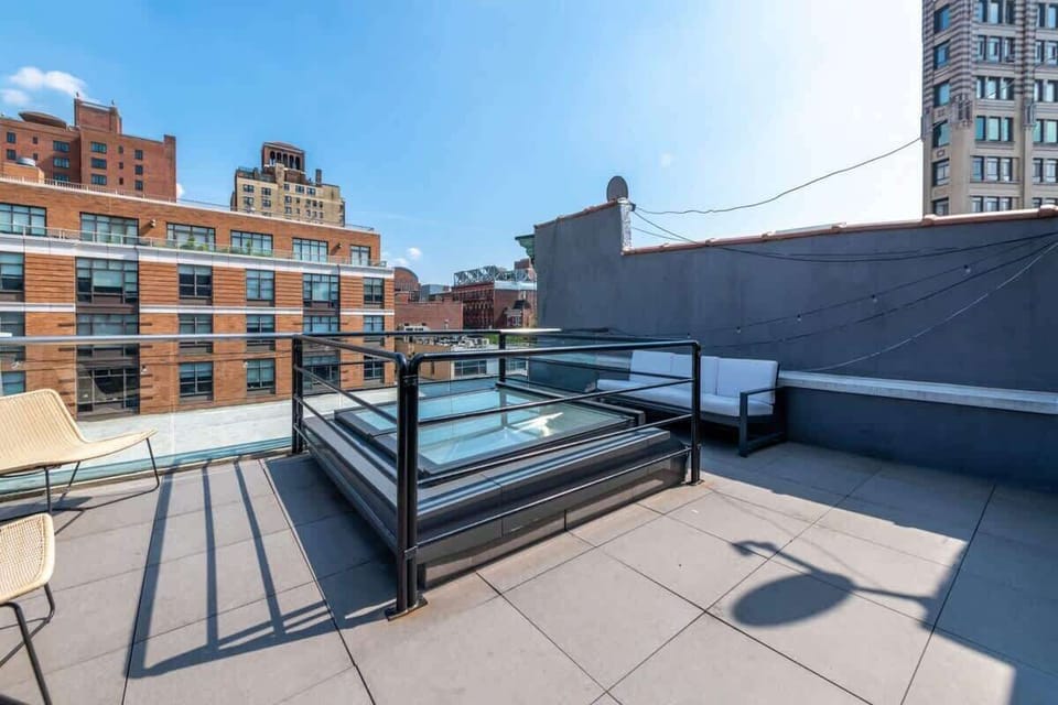 Skylight on roof terrace with outdoor couch