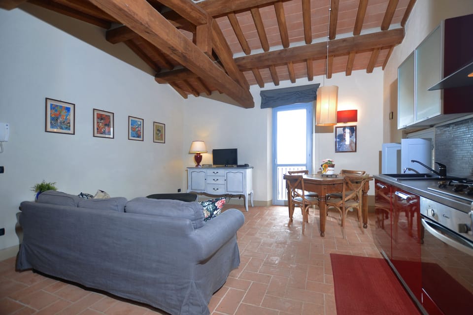 The living room with dining area and kitchen corner
