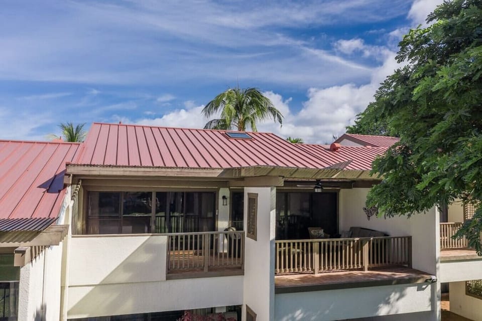 Another angle of the private lanai with the primary suite entrance on the left and living room to the right.